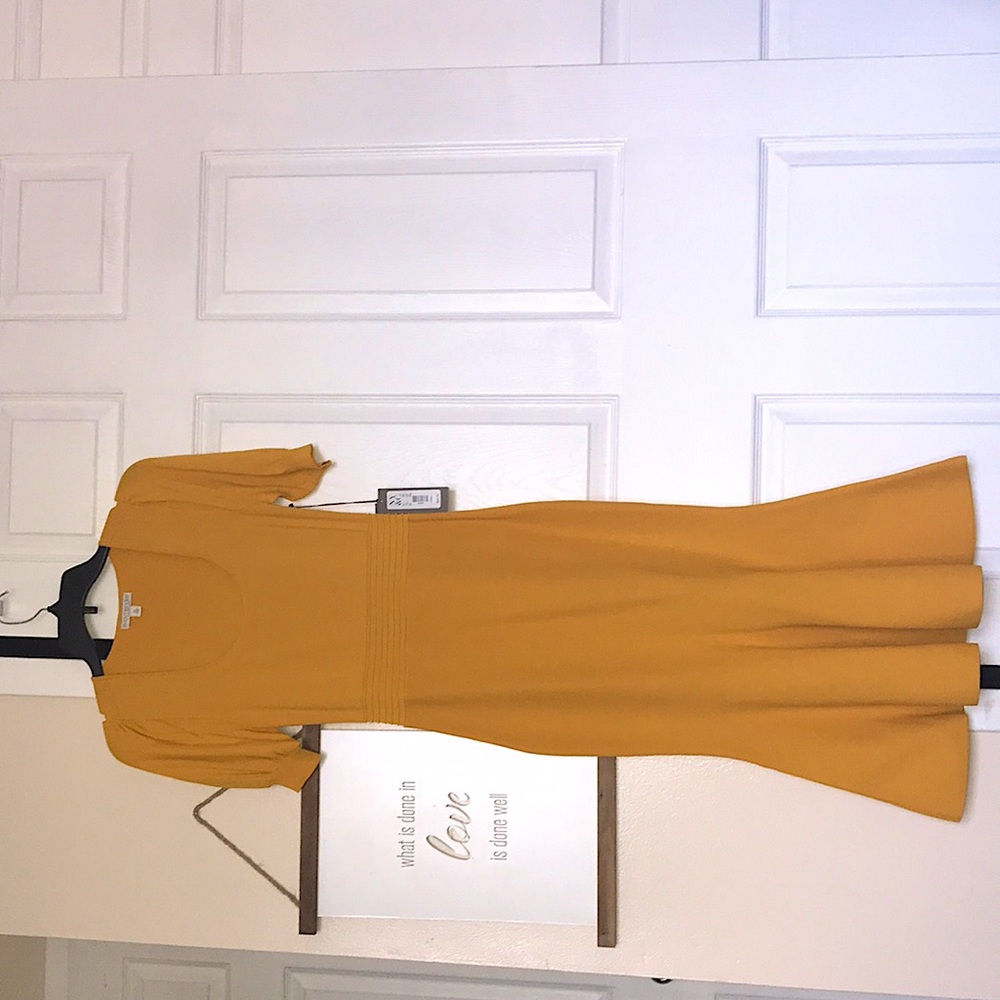 Eva Mendes golden yellow rib knit dress